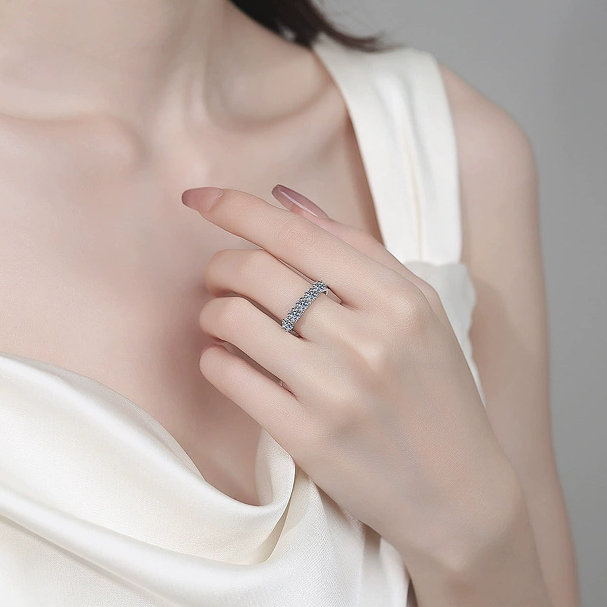 Round Moissanite Ring with CZ worn on hand to show scale, band width, and ring profile