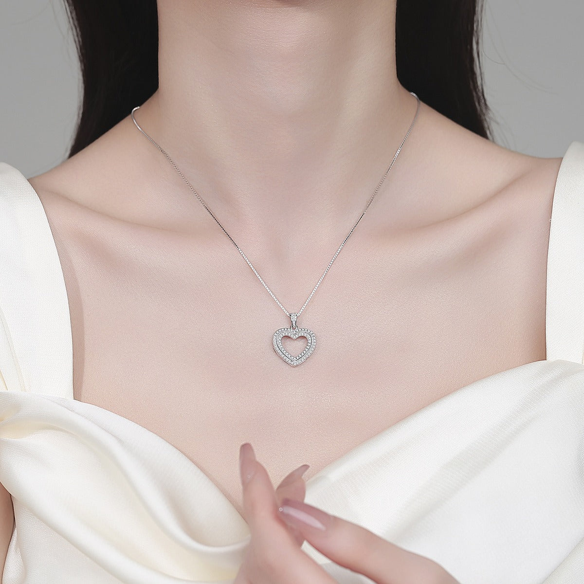 Open Heart Moissanite Pendant Necklace in Rhodium-Plated S925 sterling silver neckline model view showing pendant scale and adjustable chain