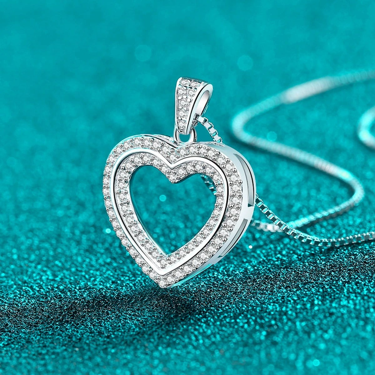 Open Heart Moissanite Pendant Necklace in Rhodium-Plated S925 sterling silver blue display scene showing chain and stone layout