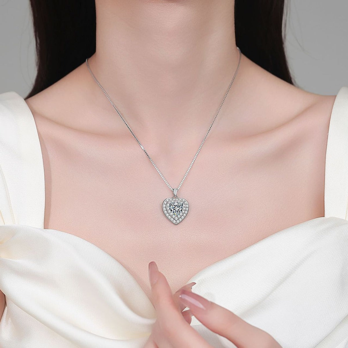 Heart Halo Moissanite Pendant Necklace with CZ in Rhodium-Plated S925 sterling silver neckline model view showing pendant scale and adjustable chain