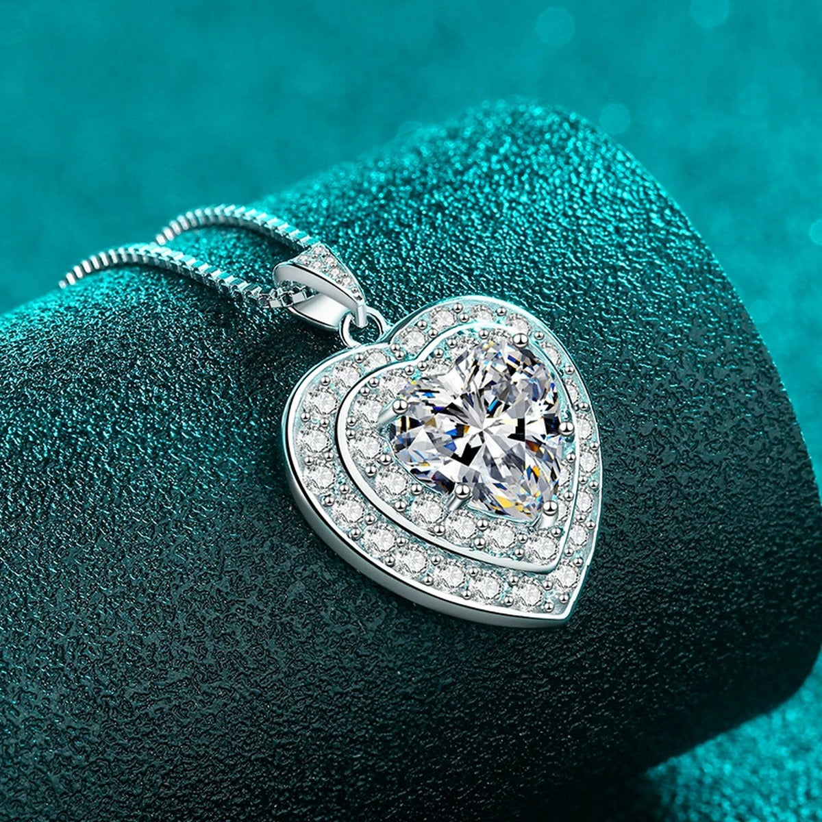 Heart Halo Moissanite Pendant Necklace with CZ in Rhodium-Plated S925 sterling silver blue display scene showing chain and stone layout
