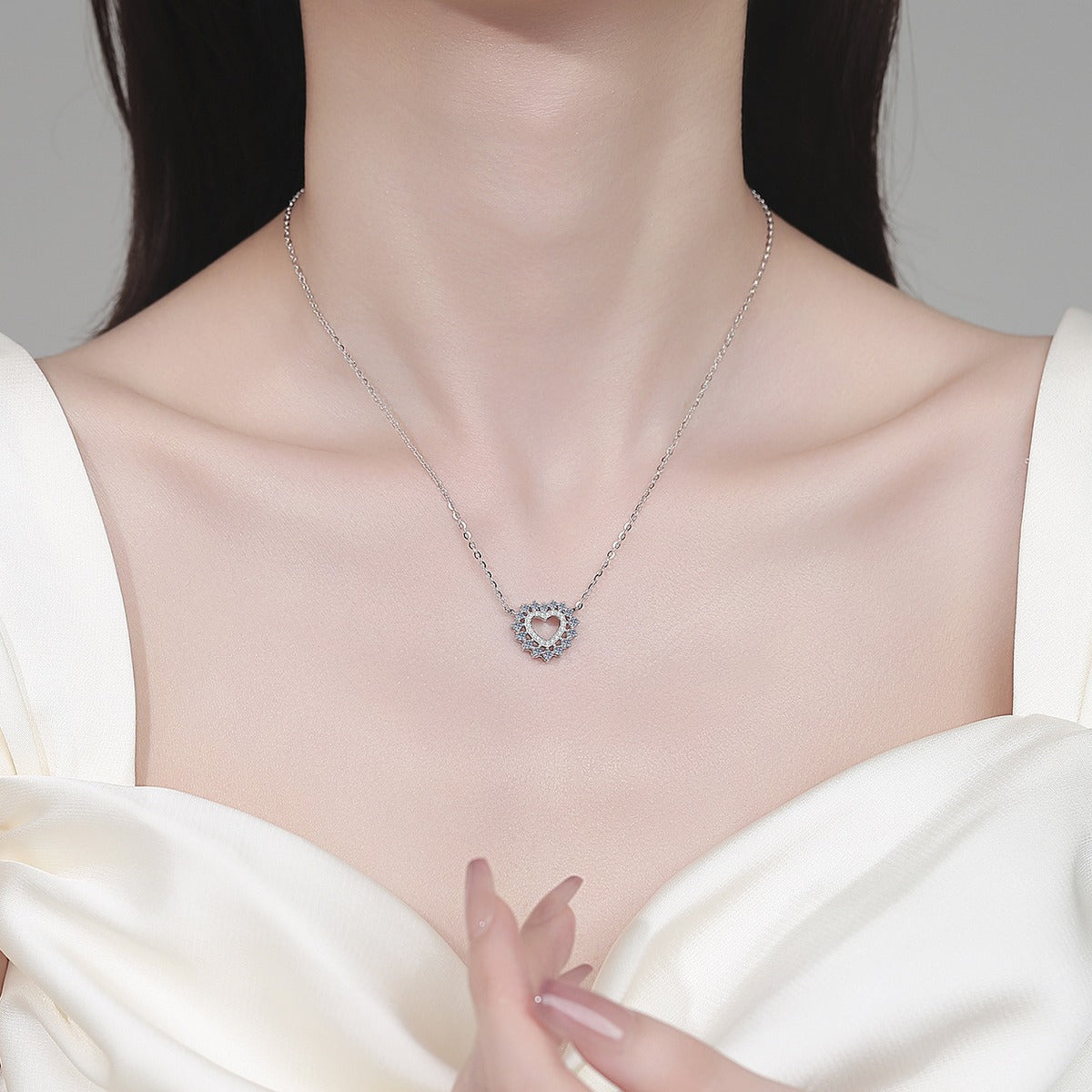 Heart Moissanite Pendant Necklace in Rhodium-Plated S925 sterling silver neckline model view showing pendant scale and adjustable chain
