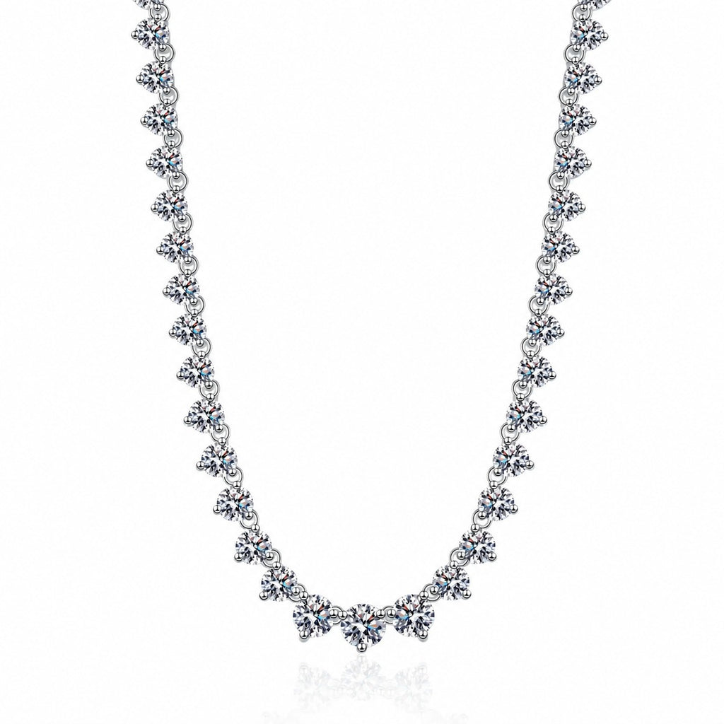 Tennis Moissanite Necklace in Rhodium-Plated S925 sterling silver white background product photo showing graduated tennis necklace with round moissanite stations across the neckline