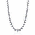 Tennis Moissanite Necklace in Rhodium-Plated S925 sterling silver white background product photo showing graduated tennis necklace with round moissanite stations across the neckline