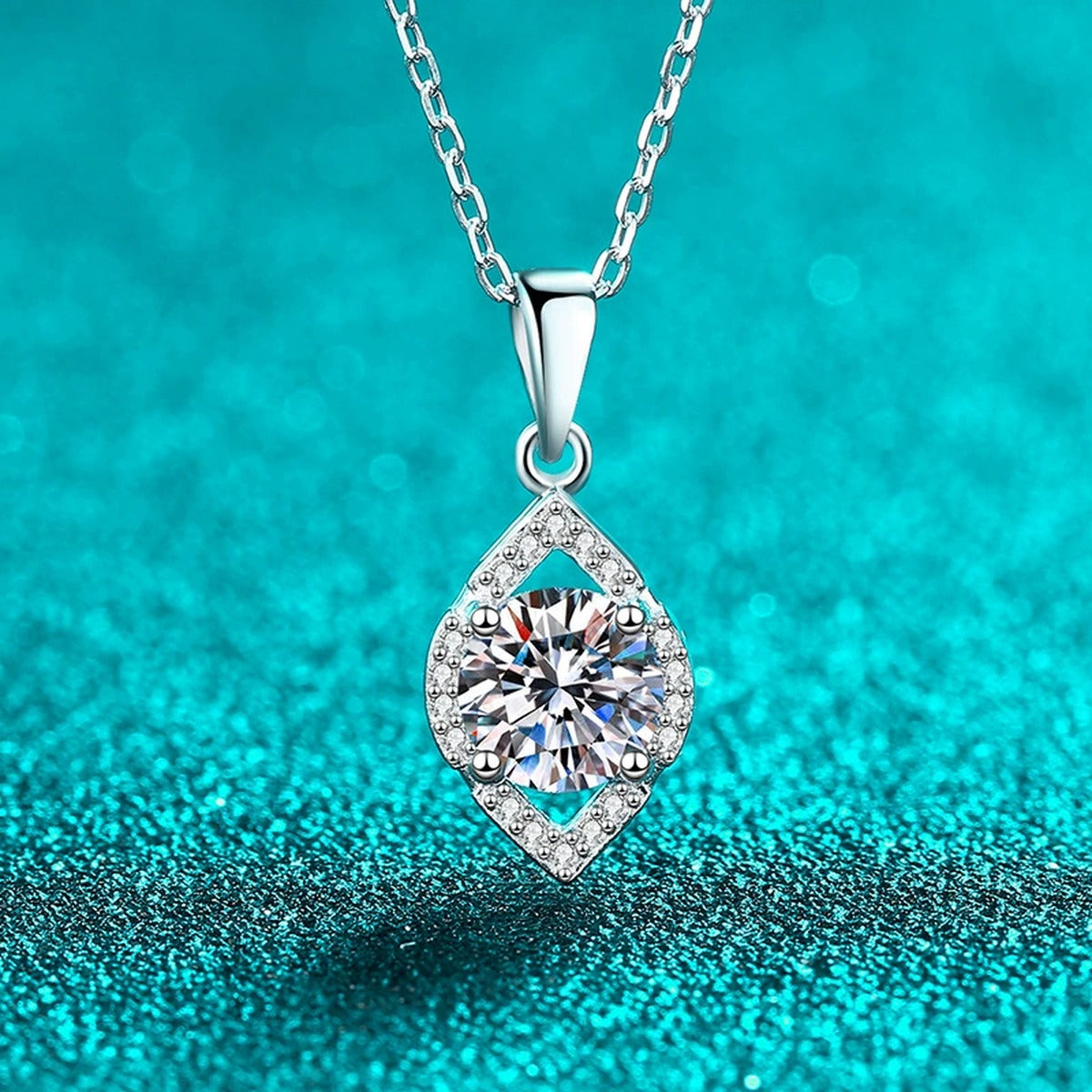 Teardrop Moissanite Pendant Necklace with CZ in Rhodium-Plated S925 sterling silver blue display scene showing chain and stone layout