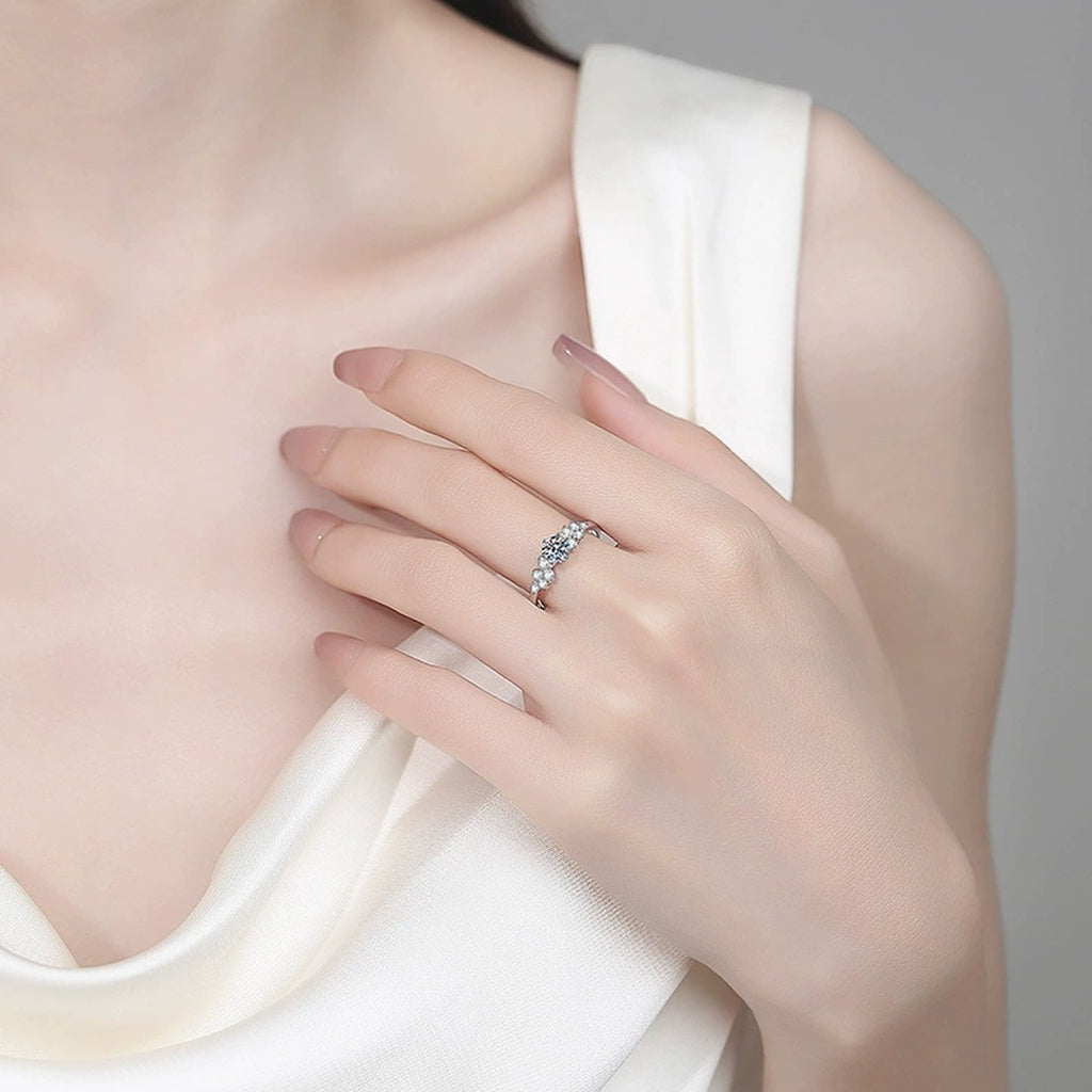 Round Moissanite Ring with CZ worn on hand to show scale, band width, and ring profile