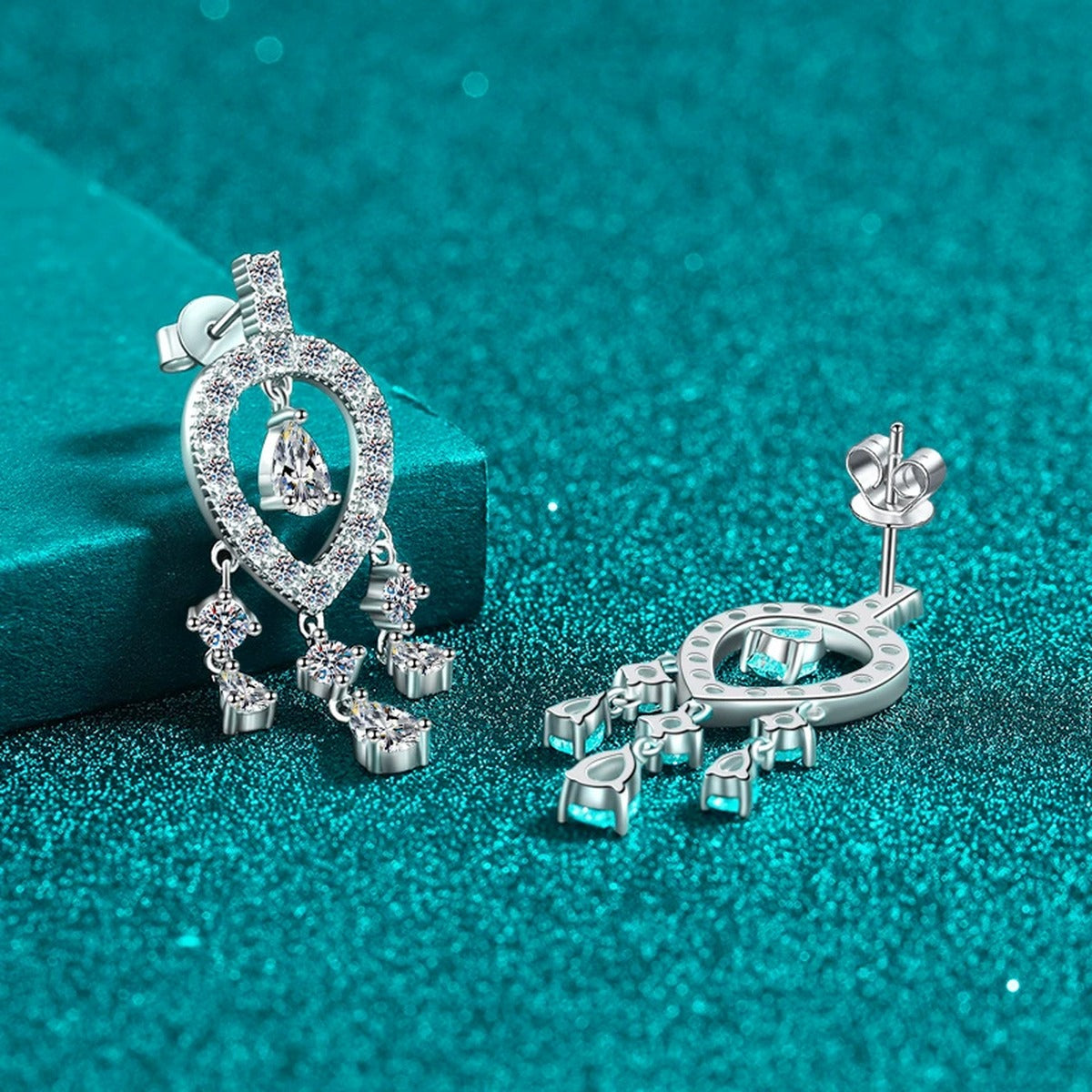 Pear and Round Moissanite Stud Chandelier Earrings in Rhodium-Plated S925 sterling silver product scene view showing front sparkle