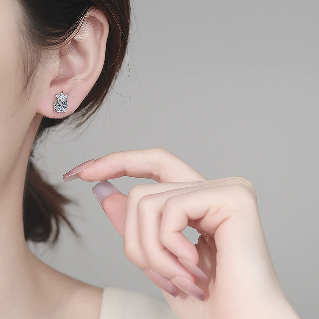 Round Moissanite Stud Earrings with CZ in Rhodium-Plated S925 sterling silver worn on ear by model showing scale, placement, and stud earrings styling