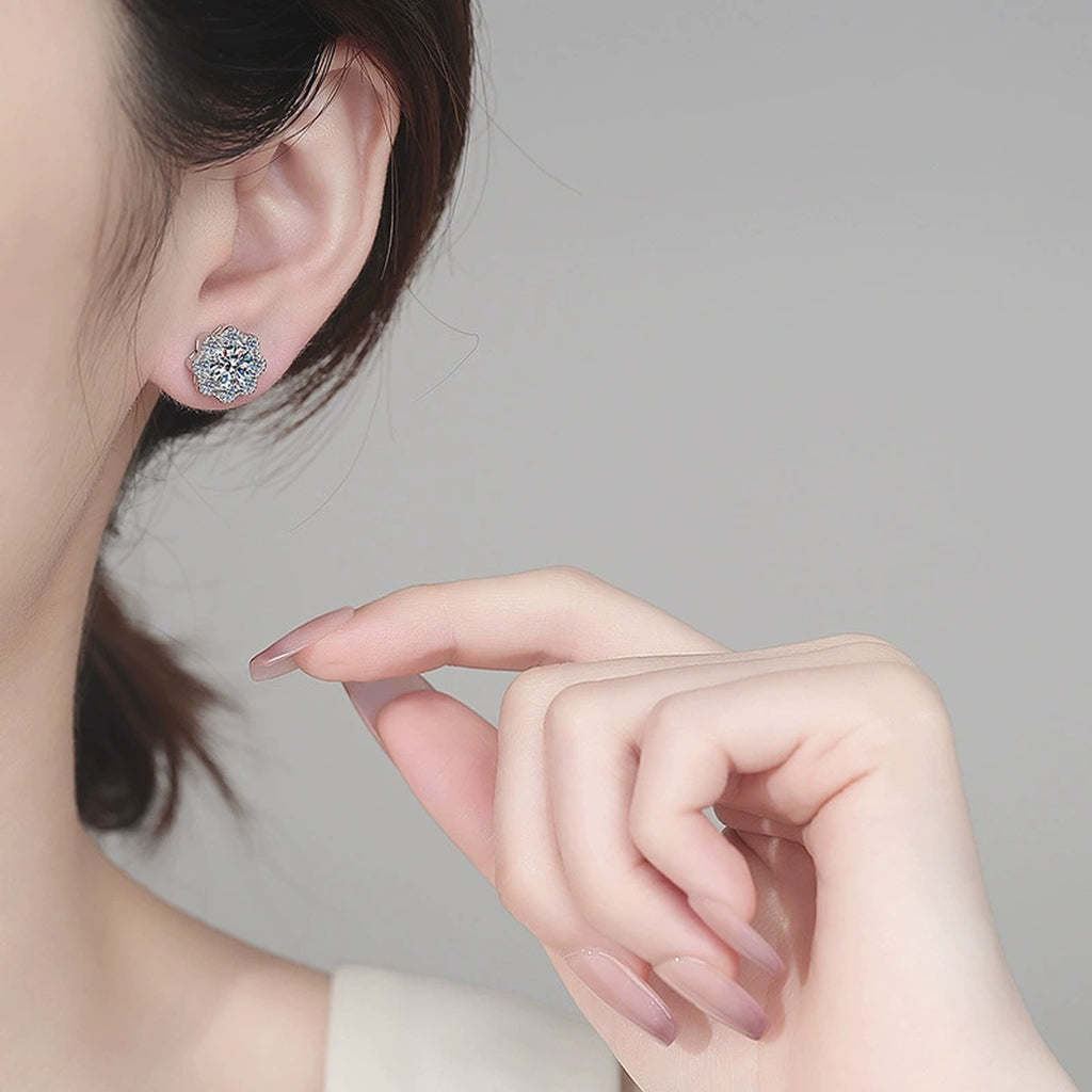 Floral Cluster Moissanite Stud Earrings with CZ in Rhodium-Plated S925 sterling silver worn on ear by model showing scale, placement, and stud earrings styling