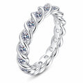 Round Moissanite Eternity Band Ring in rhodium-plated S925 sterling silver on clean white background