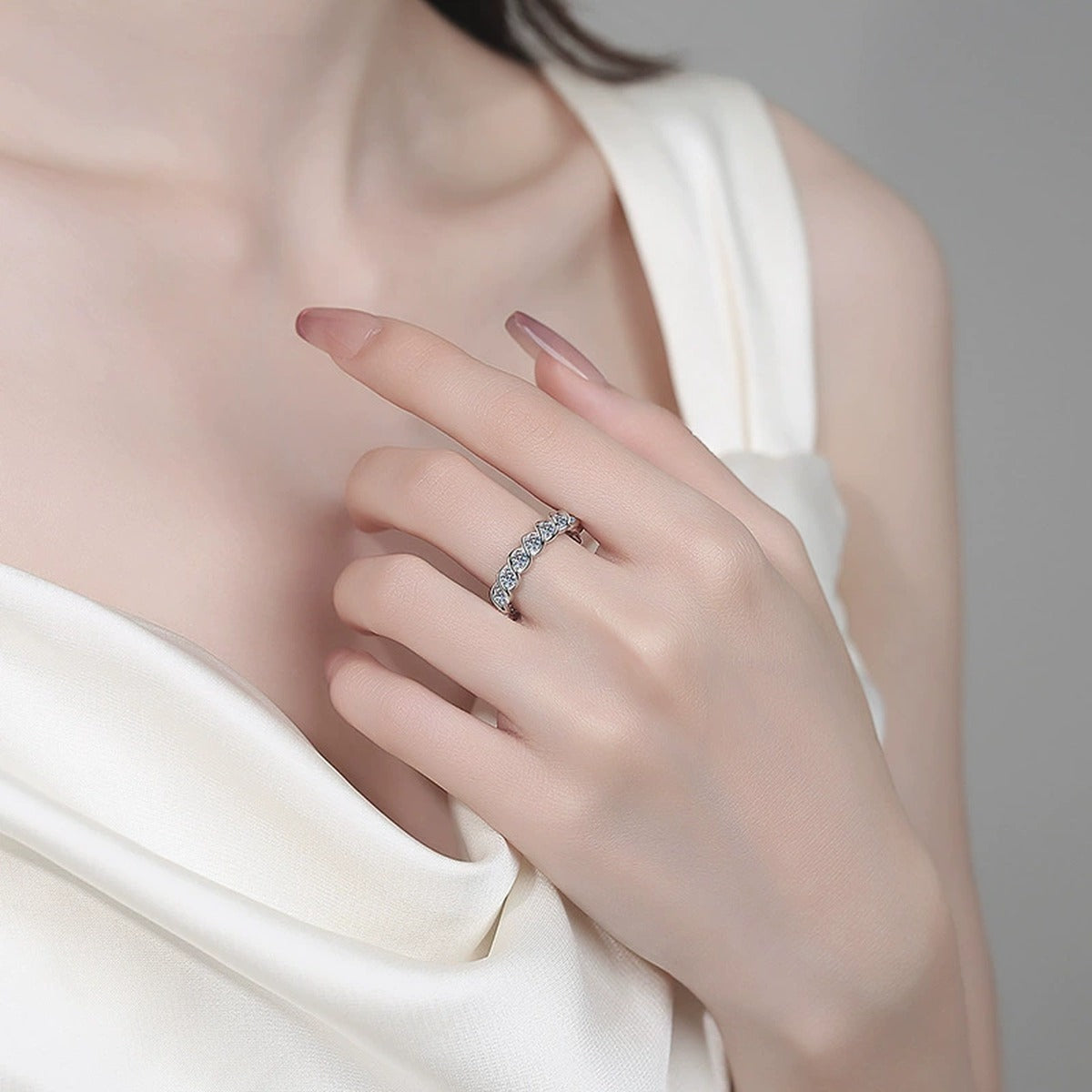 Round Moissanite Eternity Band Ring worn on hand to show scale, band width, and ring profile