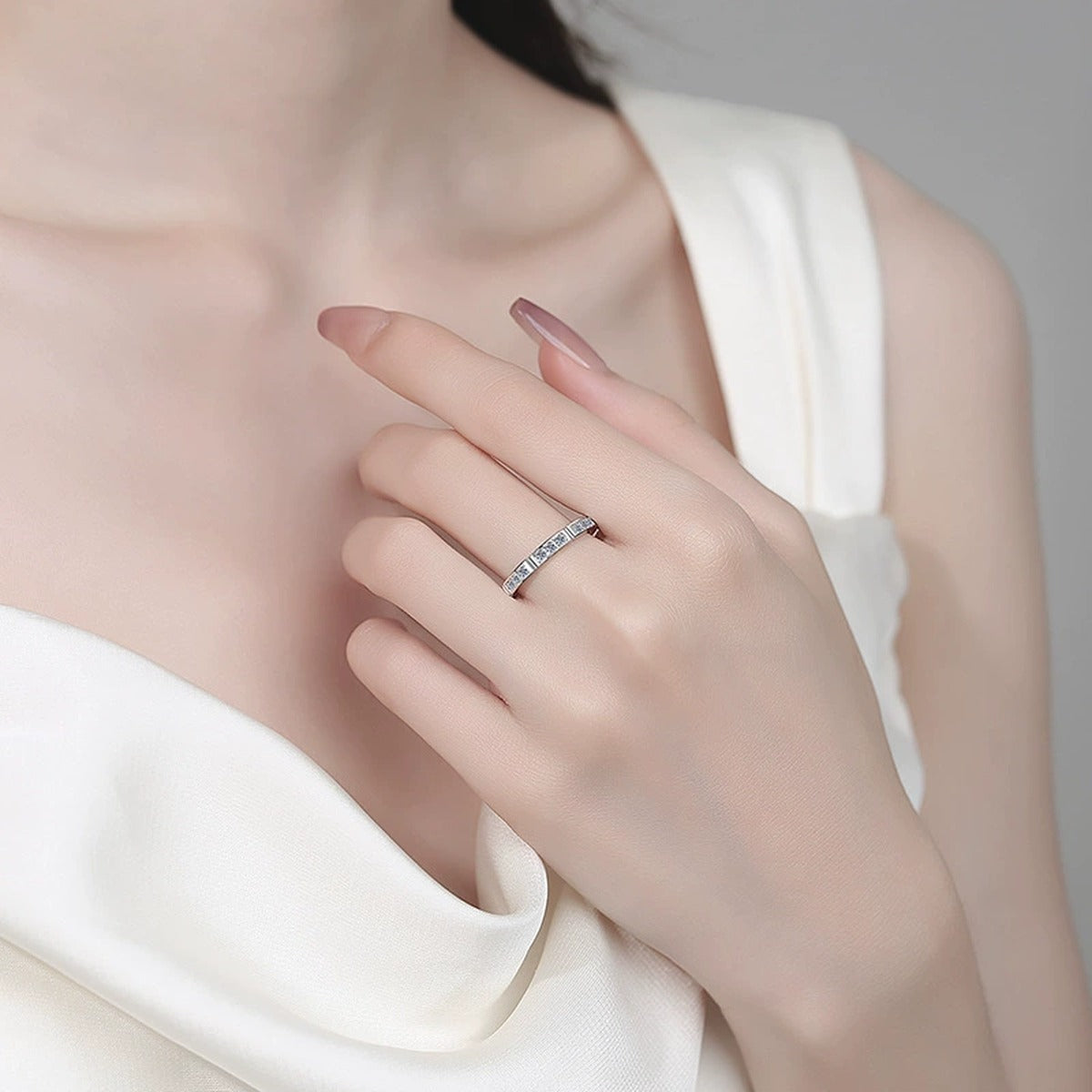 Round Moissanite Band Ring worn on hand to show scale, band width, and ring profile