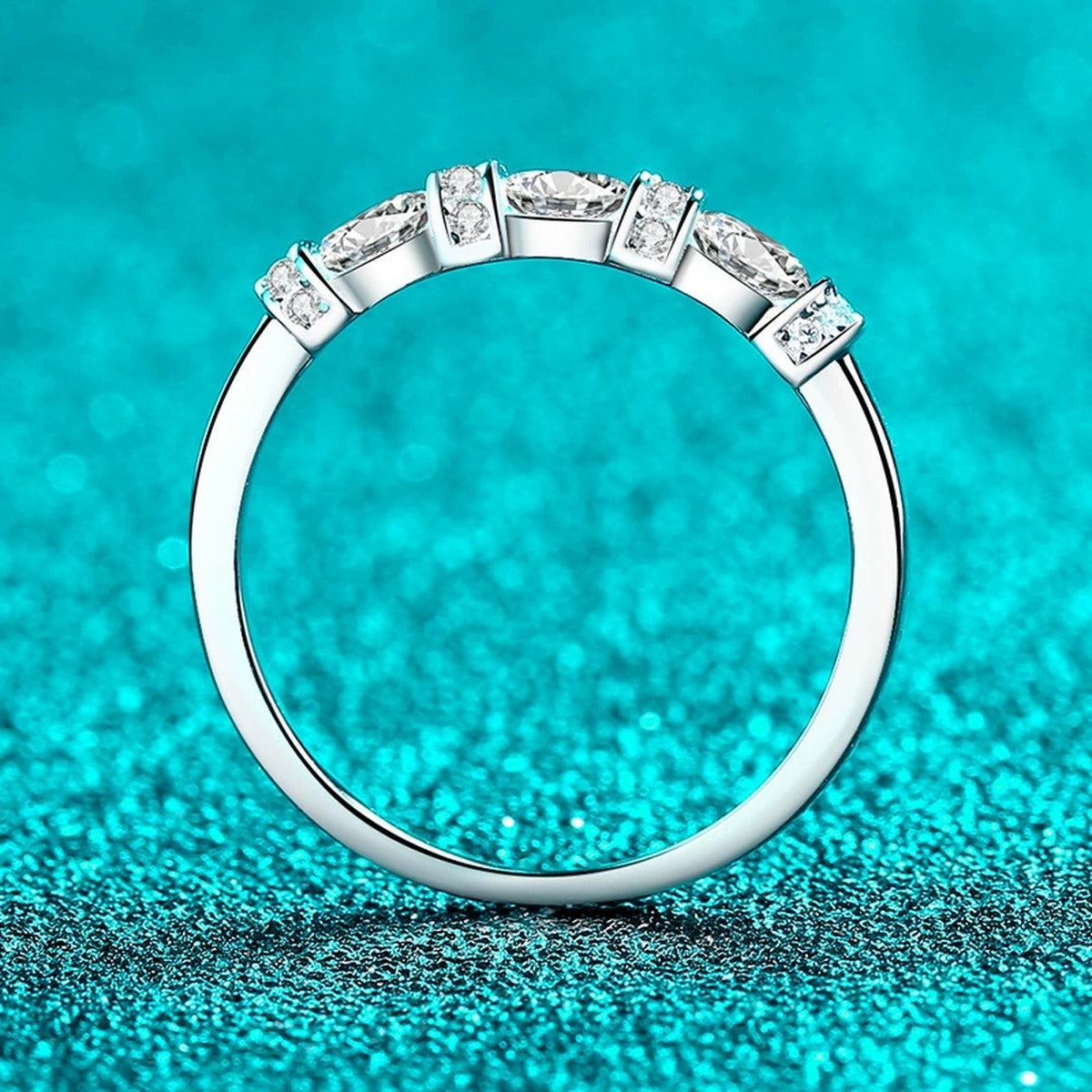 Oval and Round Moissanite Band Ring worn on hand to show scale, band width, and ring profile