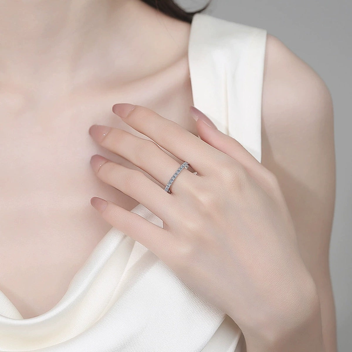 Round Moissanite Band Ring worn on hand to show scale, band width, and ring profile