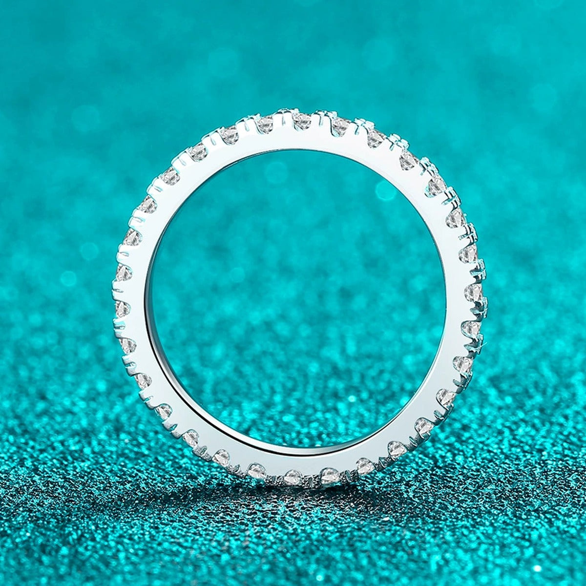 Round Moissanite Band Ring product view showing moissanite setting and metal finish