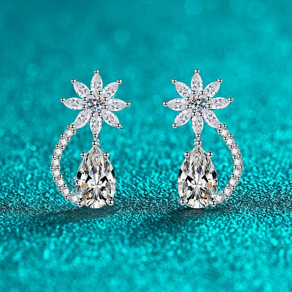 Pear Cut Moissanite Stud Drop Earrings with CZ in Rhodium-Plated S925 sterling silver product scene view showing angled setting detail