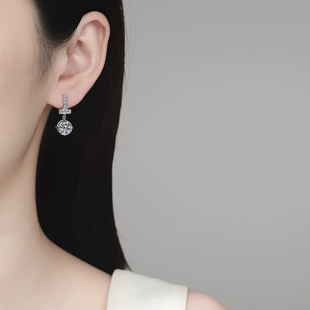Round Moissanite Hoop Dangle Earrings with CZ in Rhodium-Plated S925 sterling silver worn on ear by model showing scale, placement, and hoop dangle earrings styling