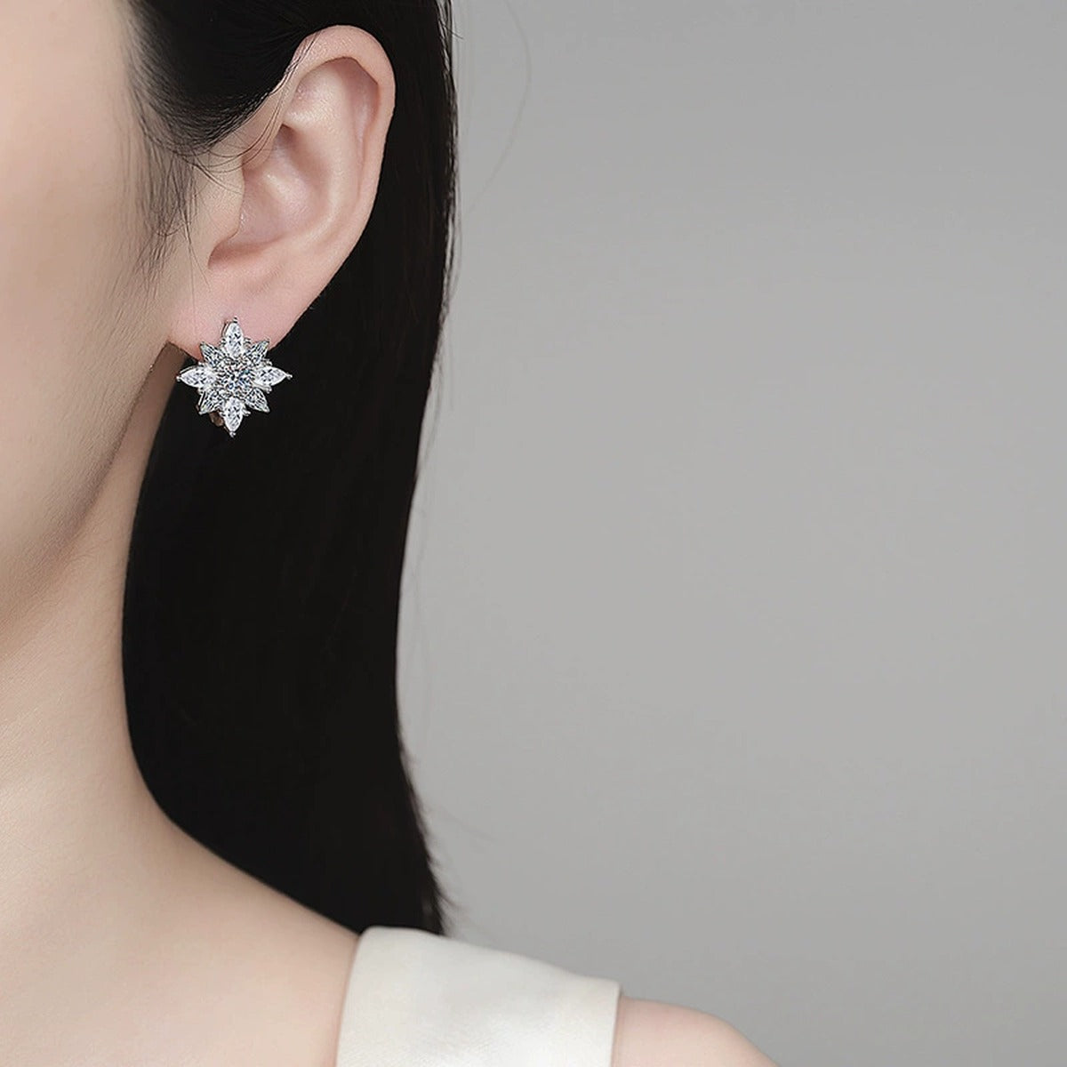 Floral Moissanite Hoop Earrings with CZ in Rhodium-Plated S925 sterling silver worn on ear by model showing scale, placement, and hoop earrings styling