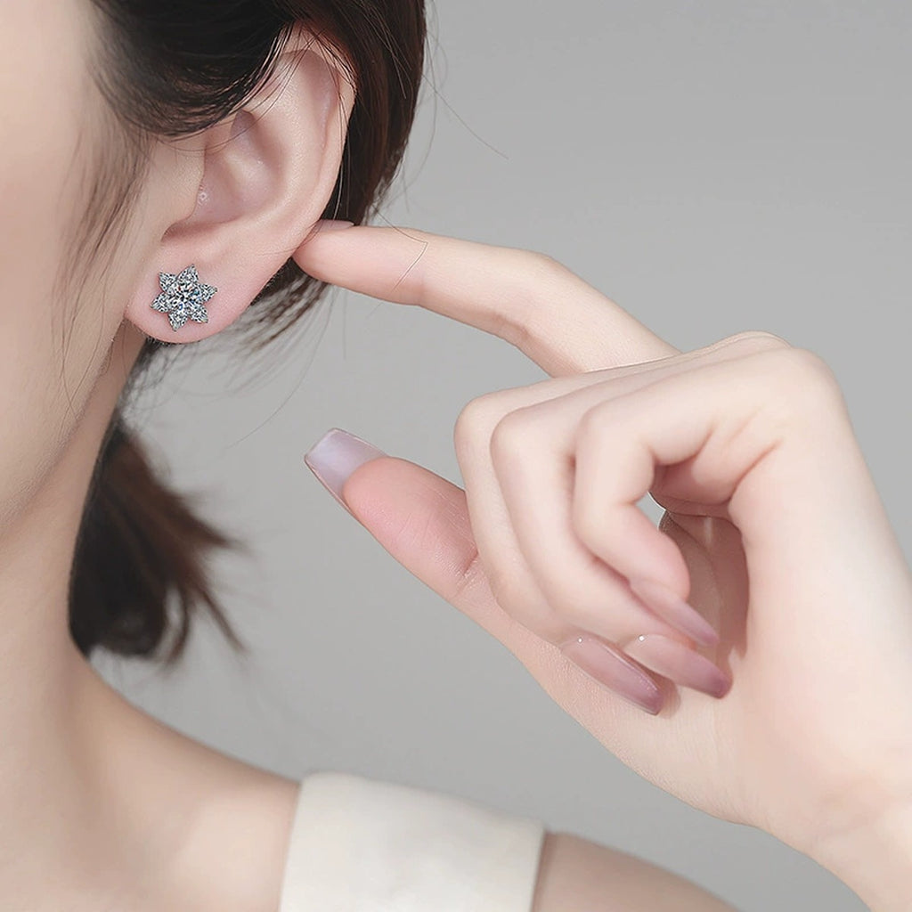 Star Cluster Moissanite Stud Earrings in Rhodium-Plated S925 sterling silver worn on ear by model showing scale, placement, and stud earrings styling