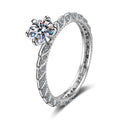 Round Moissanite Twist Engagement Ring with CZ in rhodium-plated S925 sterling silver on clean white background