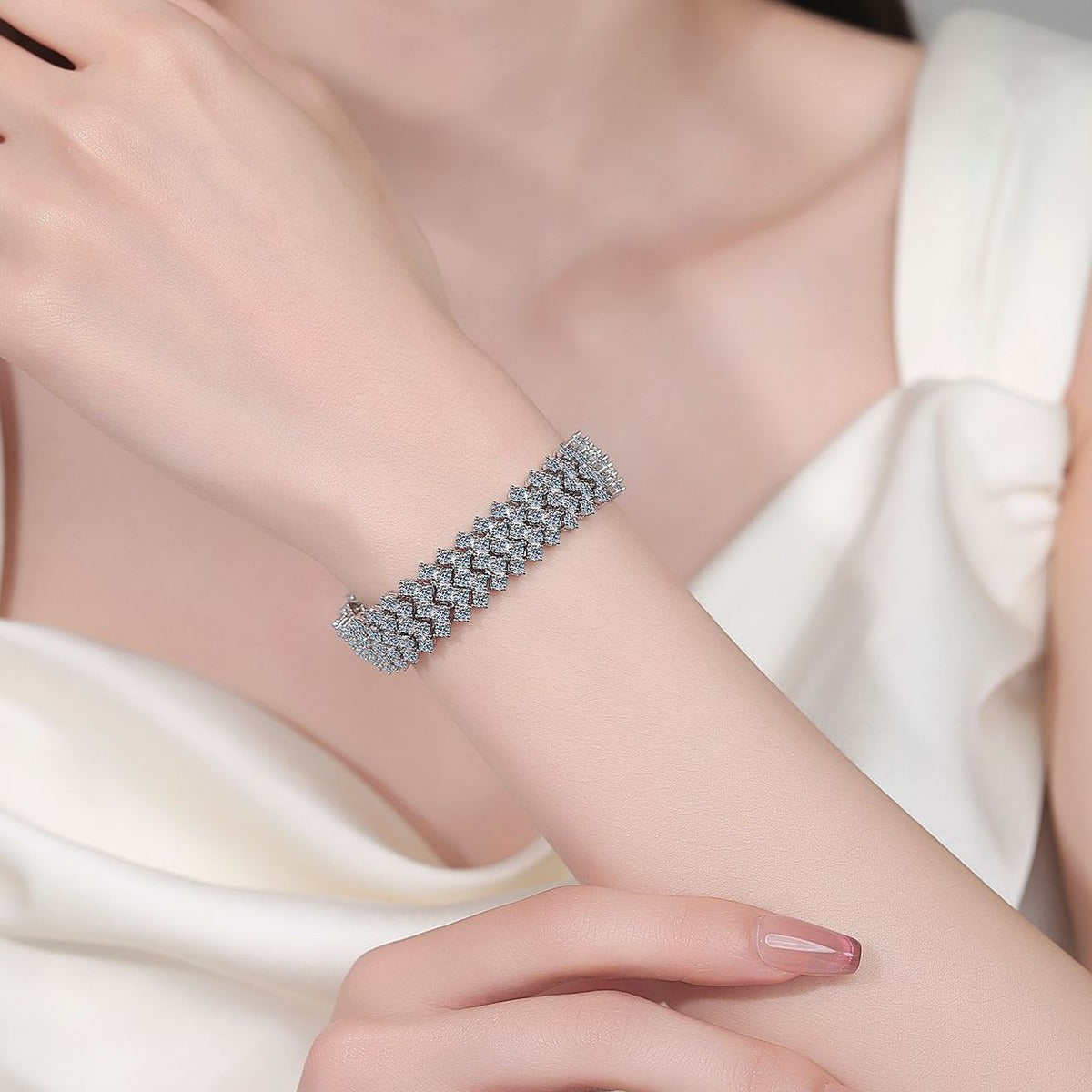 Wide Round Moissanite Tennis Bracelet in Rhodium-Plated S925 sterling silver worn on wrist model view showing scale and adjustable fit