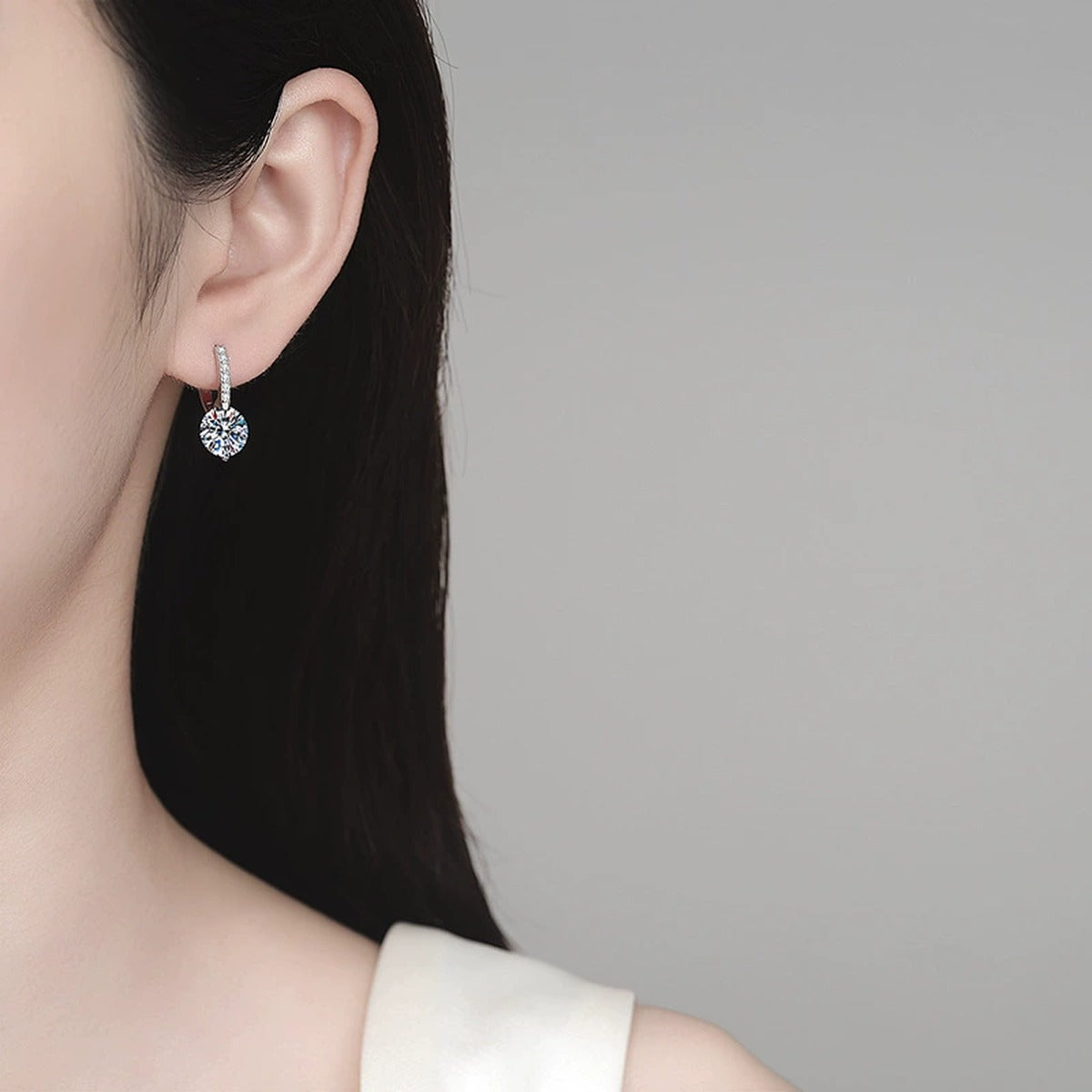 Round Moissanite Hoop Drop Earrings with CZ in Rhodium-Plated S925 sterling silver worn on ear by model showing scale, placement, and hoop drop earrings styling