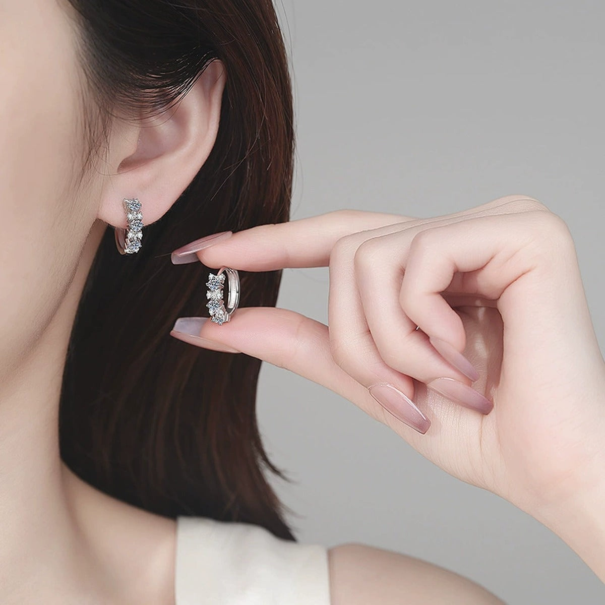 Cluster Moissanite Hoop Earrings in Rhodium-Plated S925 sterling silver worn on ear by model showing scale, placement, and hoop earrings styling