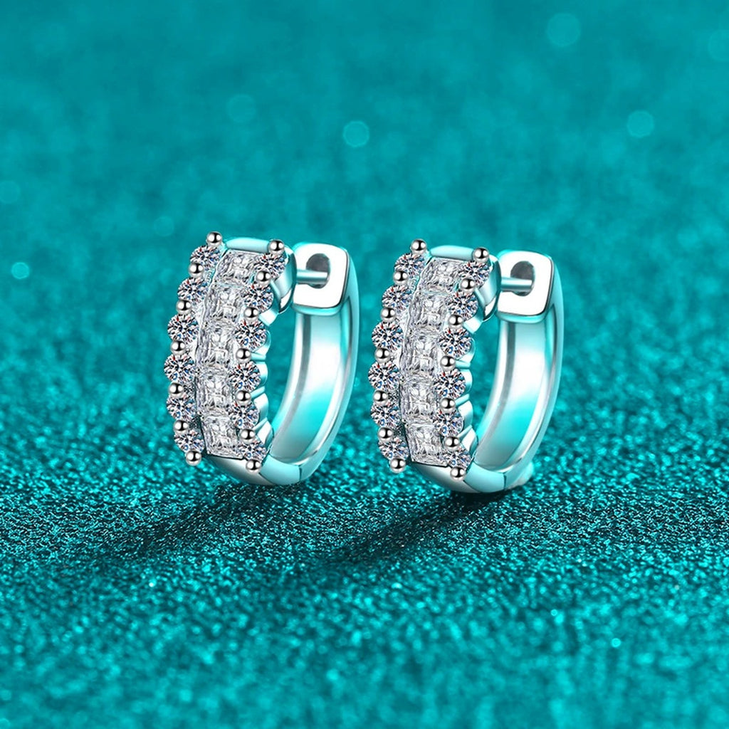 Round and Princess Cut Moissanite Huggie Hoop Earrings in Rhodium-Plated S925 sterling silver product scene view showing front sparkle