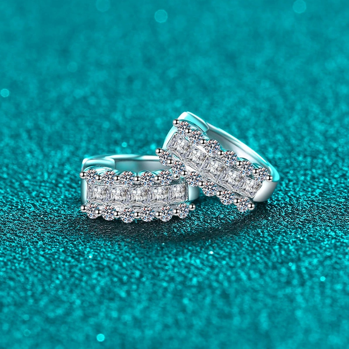 Round and Princess Cut Moissanite Huggie Hoop Earrings in Rhodium-Plated S925 sterling silver product scene view showing angled setting detail