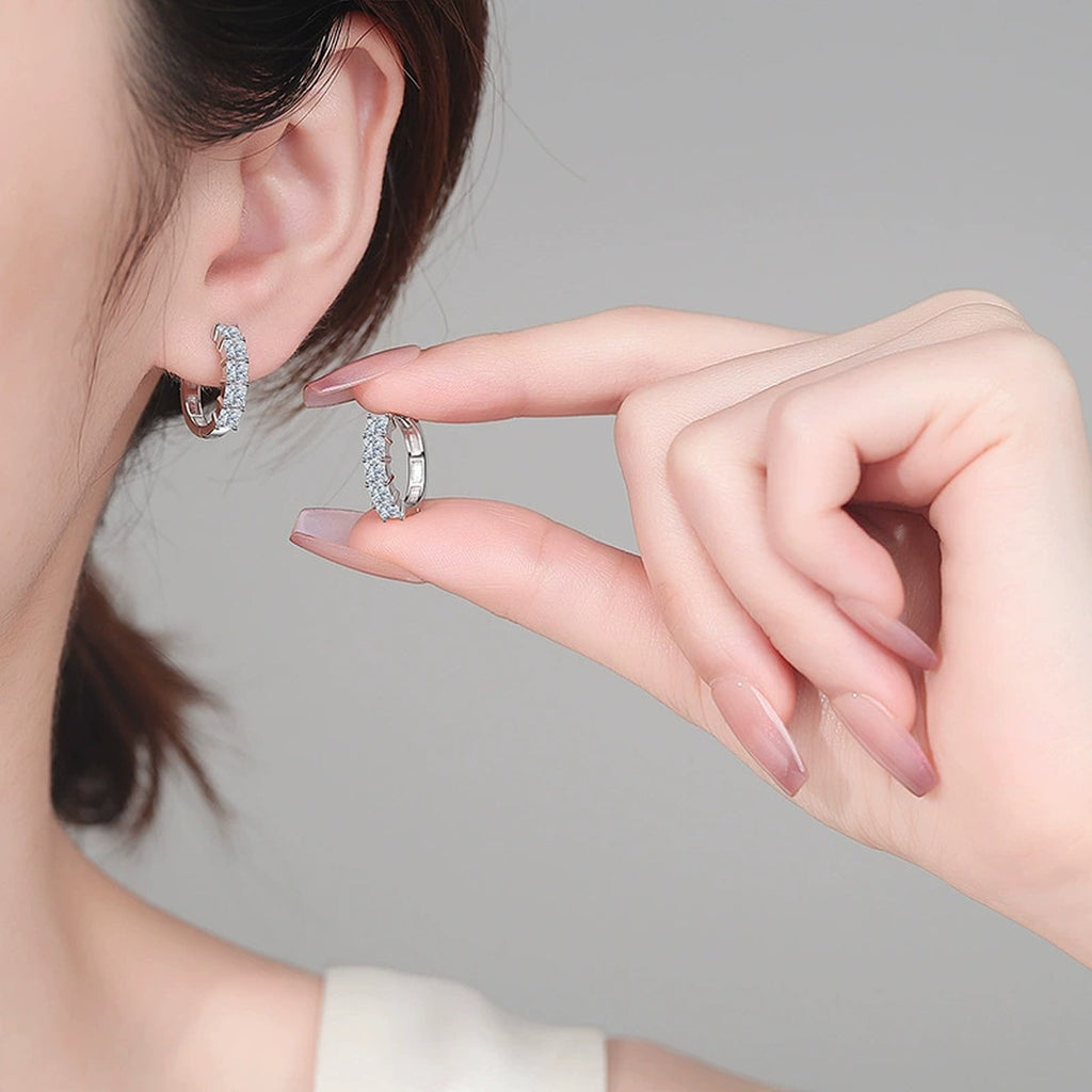 Princess Cut Moissanite Hoop Earrings in Rhodium-Plated S925 sterling silver worn on ear by model showing scale, placement, and hoop earrings styling