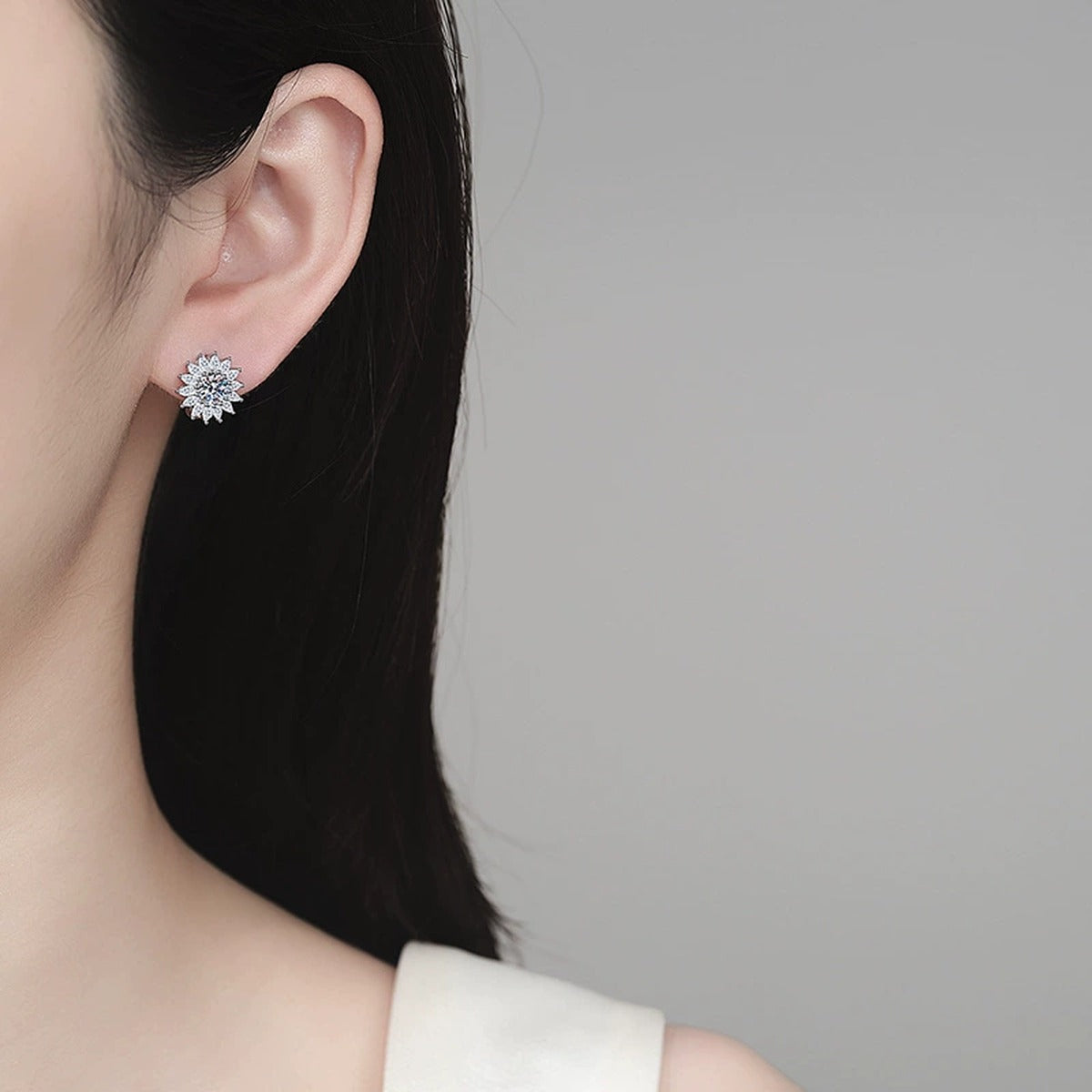 Floral Moissanite Hoop Earrings with CZ in Rhodium-Plated S925 sterling silver worn on ear by model showing scale, placement, and hoop earrings styling