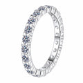 Round Moissanite Band Ring in rhodium-plated S925 sterling silver on clean white background