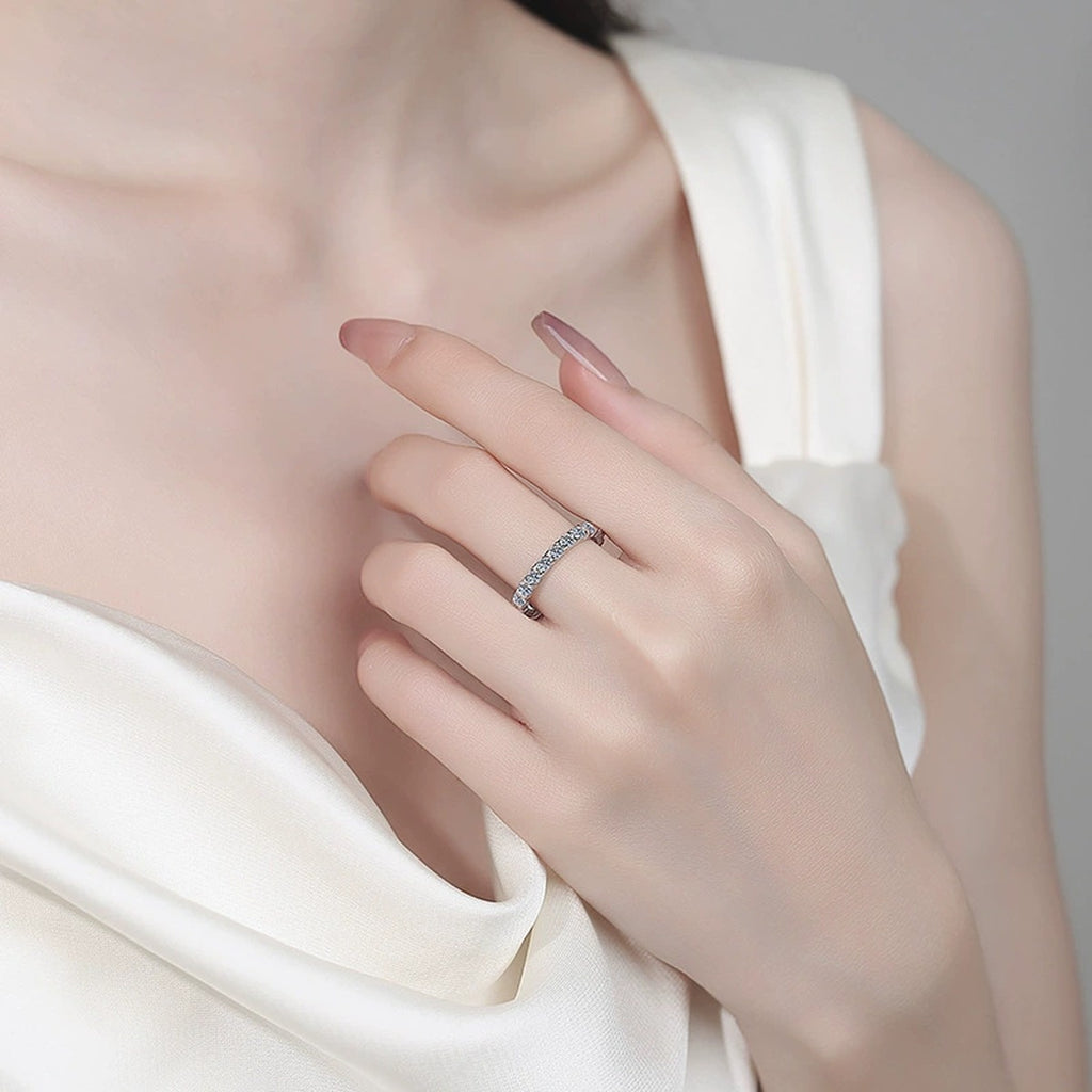 Round Moissanite Band Ring worn on hand to show scale, band width, and ring profile