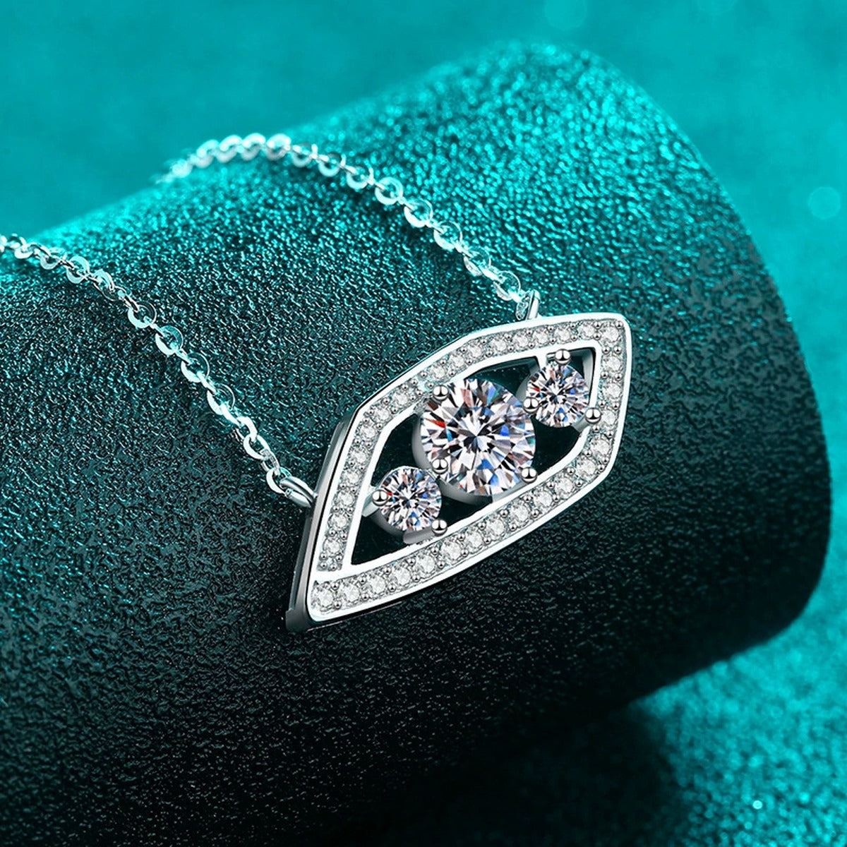 Geometric Eye Moissanite Pendant Necklace with CZ in Rhodium-Plated S925 sterling silver blue display scene showing chain and stone layout