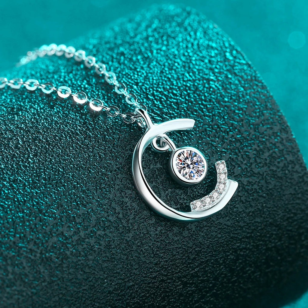 Dancing Moon Moissanite Pendant Necklace in Rhodium-Plated S925 sterling silver close-up product scene showing pendant setting