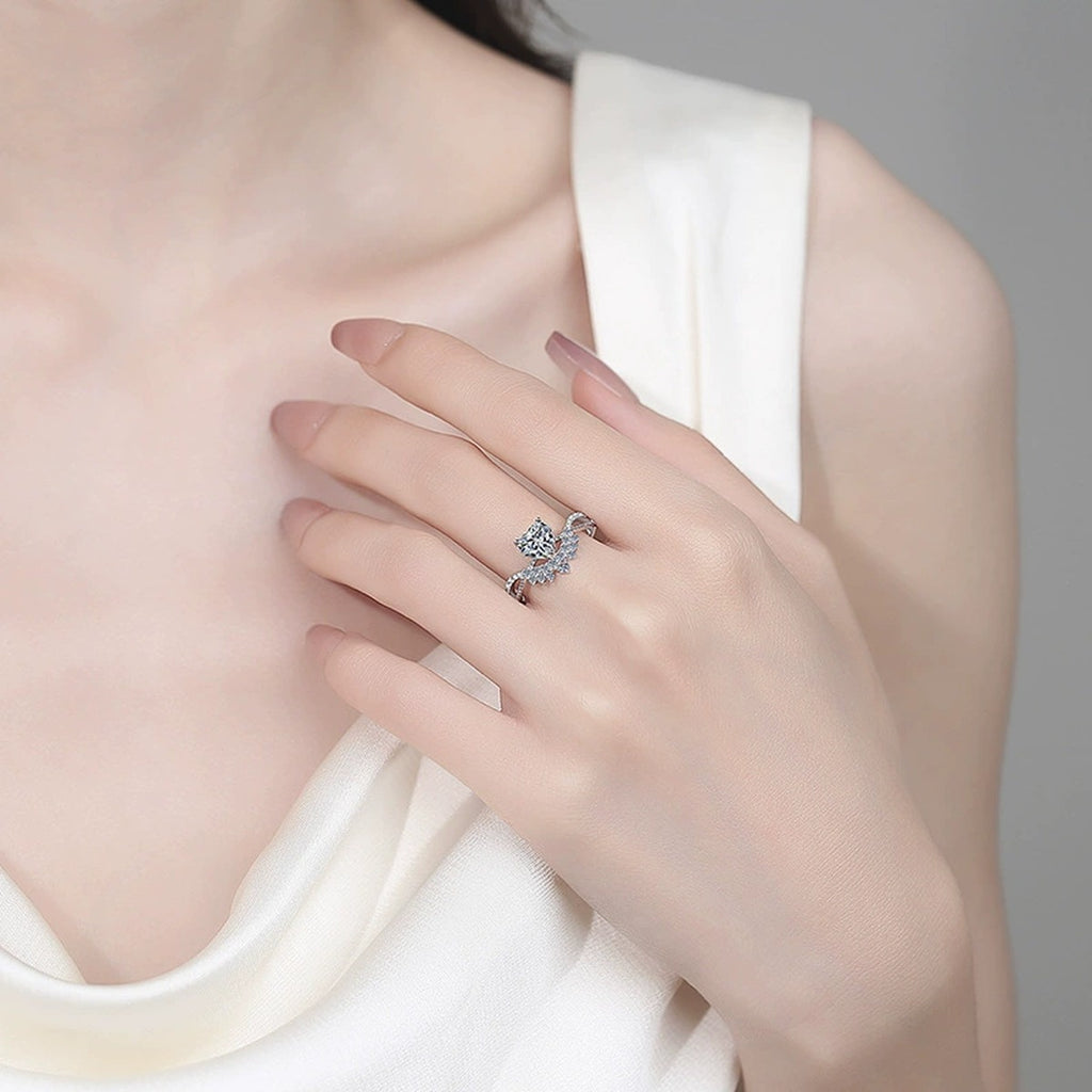Heart Cut Moissanite Ring with CZ worn on hand to show scale, band width, and ring profile