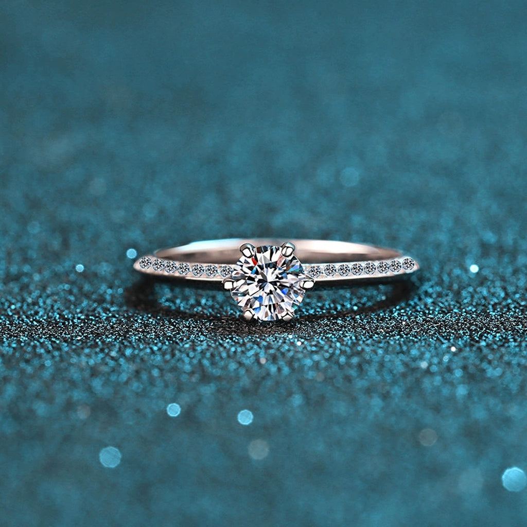Round Moissanite Side Stone Engagement Ring with CZ product view showing moissanite setting and metal finish
