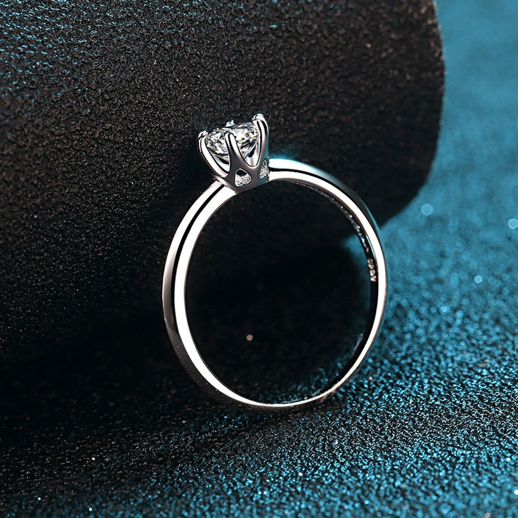Round Moissanite Side Stone Engagement Ring with CZ product view showing moissanite setting and metal finish