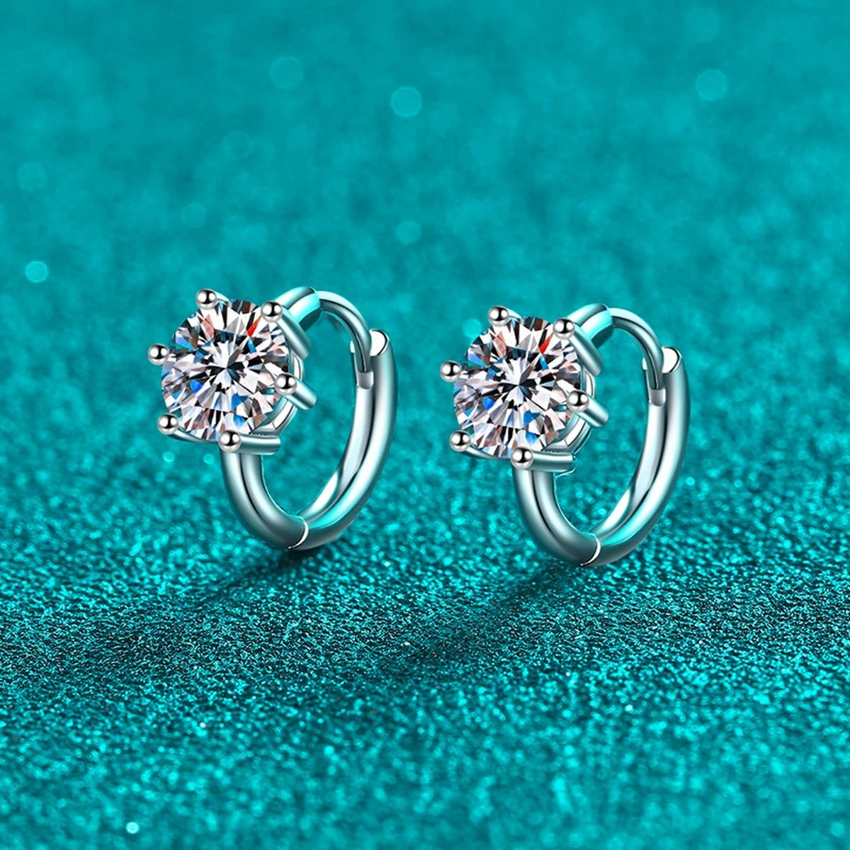 Round Moissanite Huggie Hoop Earrings in Rhodium-Plated S925 sterling silver product scene view showing angled setting detail