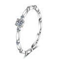 Twist Moissanite Band Ring with CZ in Rhodium-Plated S925 Sterling Silver clean white background product photo showing the ring silhouette and moissanite setting