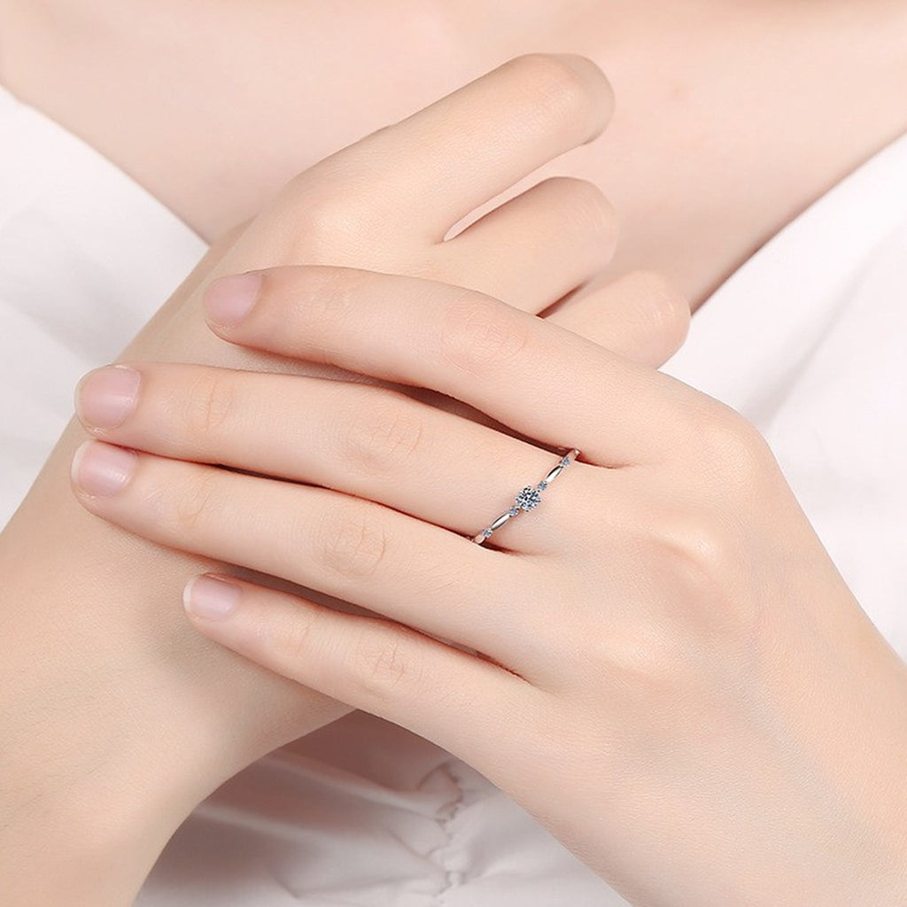 Twist Moissanite Band Ring with CZ in Rhodium-Plated S925 Sterling Silver worn on hand, showing scale, finger coverage, and rhodium-plated finish