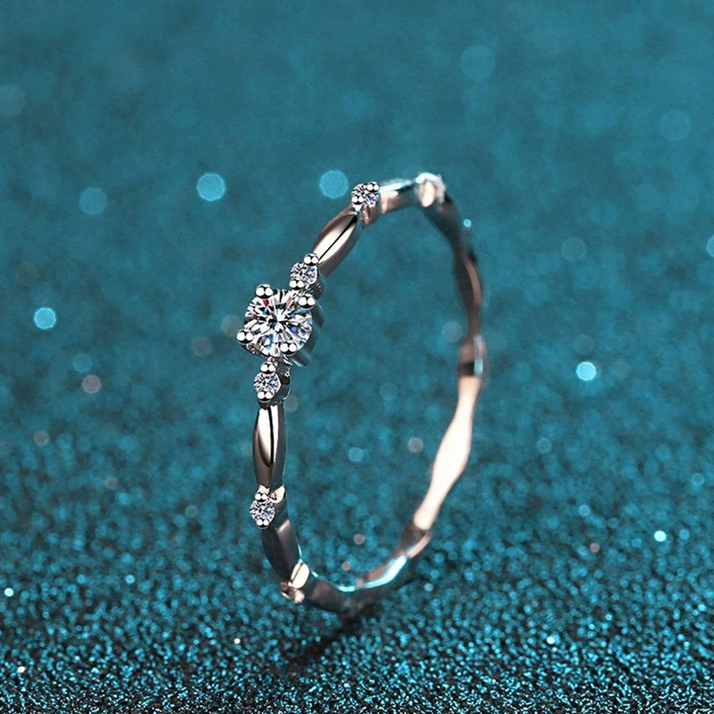 Twist Moissanite Band Ring with CZ in Rhodium-Plated S925 Sterling Silver blue display product photo showing the moissanite setting and band profile