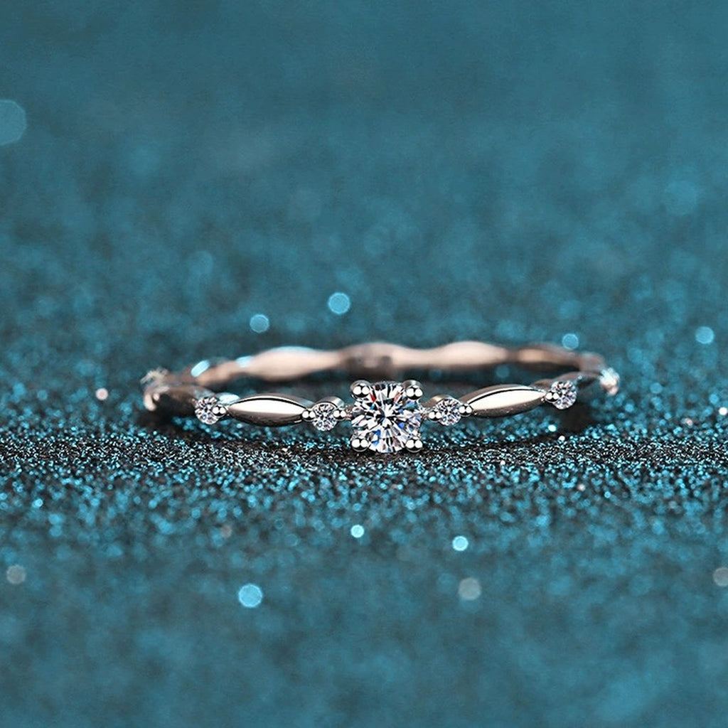 Twist Moissanite Band Ring with CZ in Rhodium-Plated S925 Sterling Silver blue display product photo showing the moissanite setting and band profile