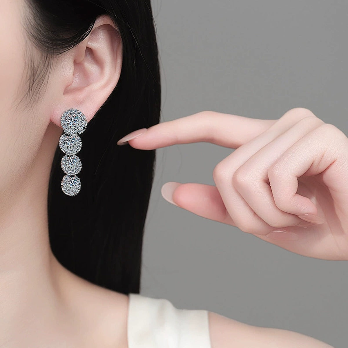 Mixed Cut Moissanite Stud Drop Earrings in Rhodium-Plated S925 sterling silver worn on ear by model showing scale, placement, and stud earrings styling