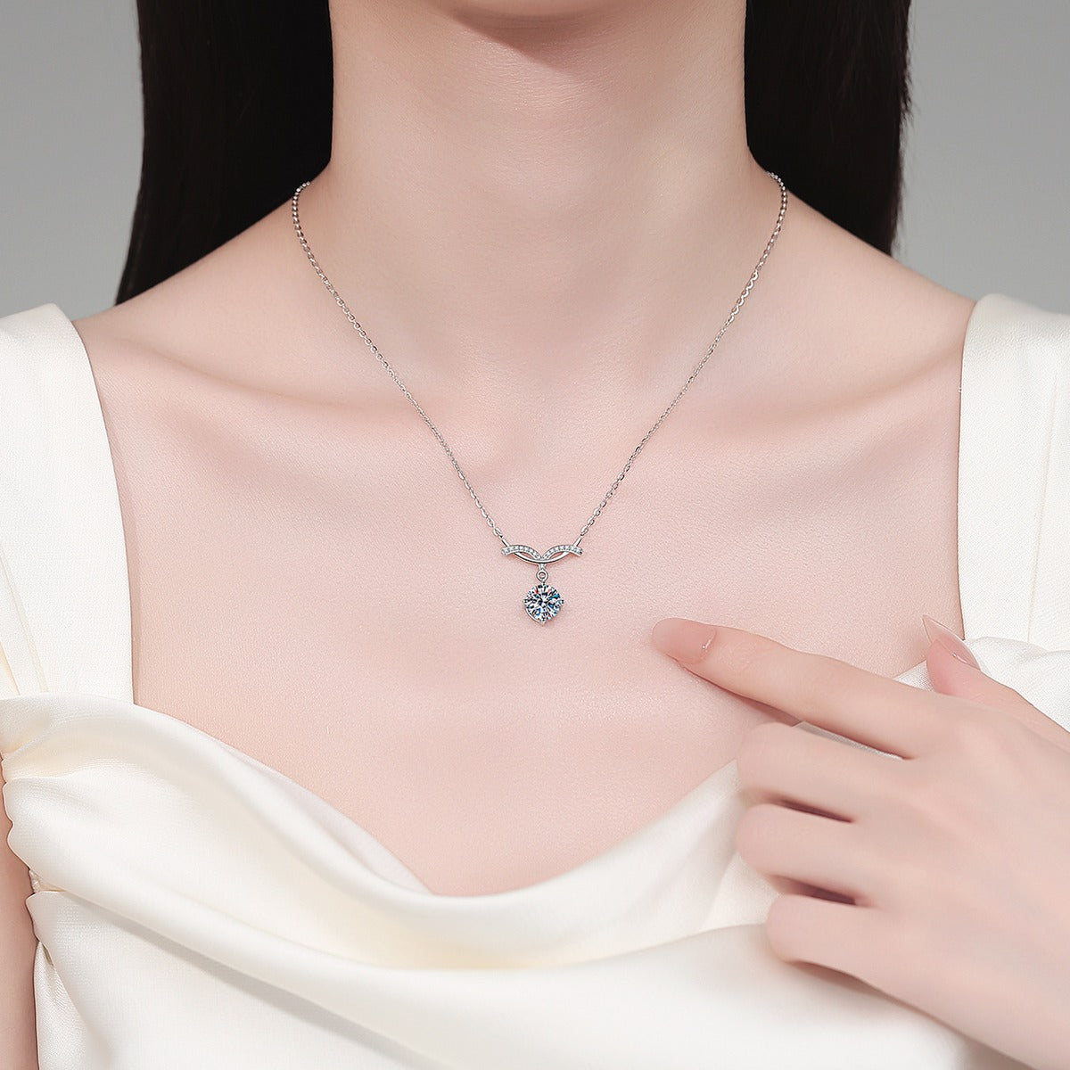 Angel Wing Round Moissanite Pendant Necklace with CZ in Rhodium-Plated S925 sterling silver neckline model view showing pendant scale and adjustable chain