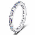 Emerald Cut Moissanite Band Ring in rhodium-plated S925 sterling silver on clean white background