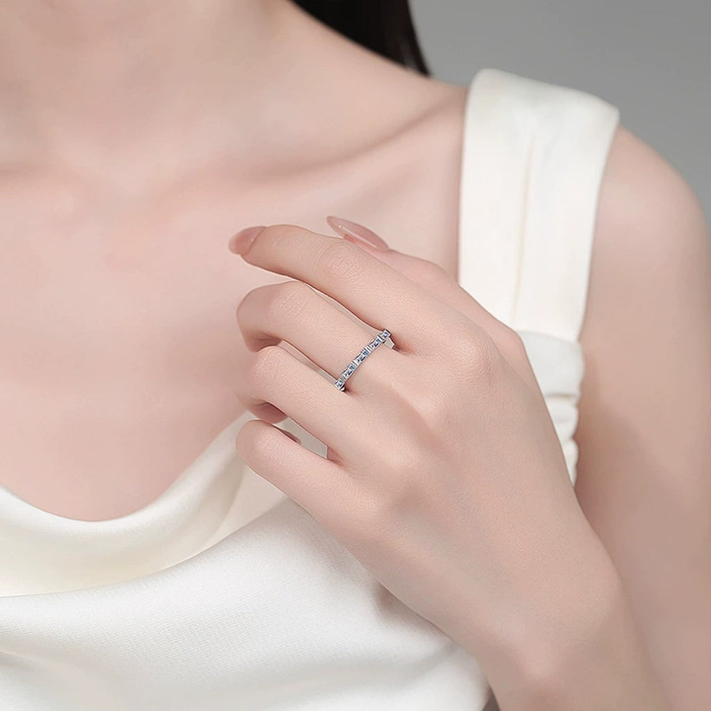Emerald Cut Moissanite Band Ring worn on hand to show scale, band width, and ring profile