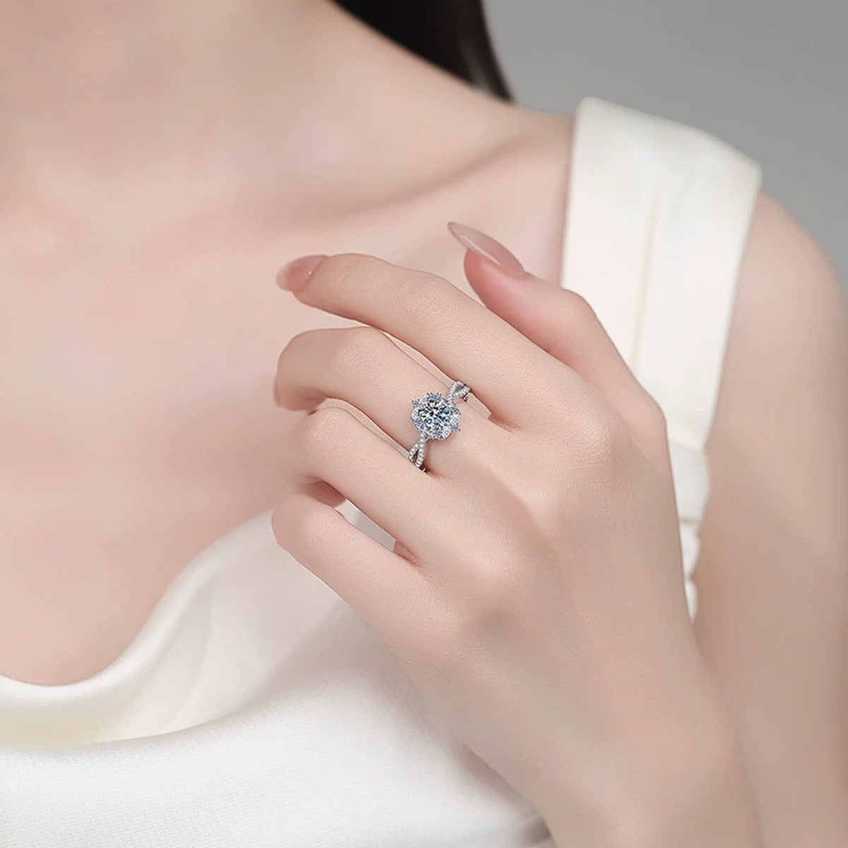 Oval Moissanite Halo Engagement Ring with CZ worn on hand to show scale, band width, and ring profile