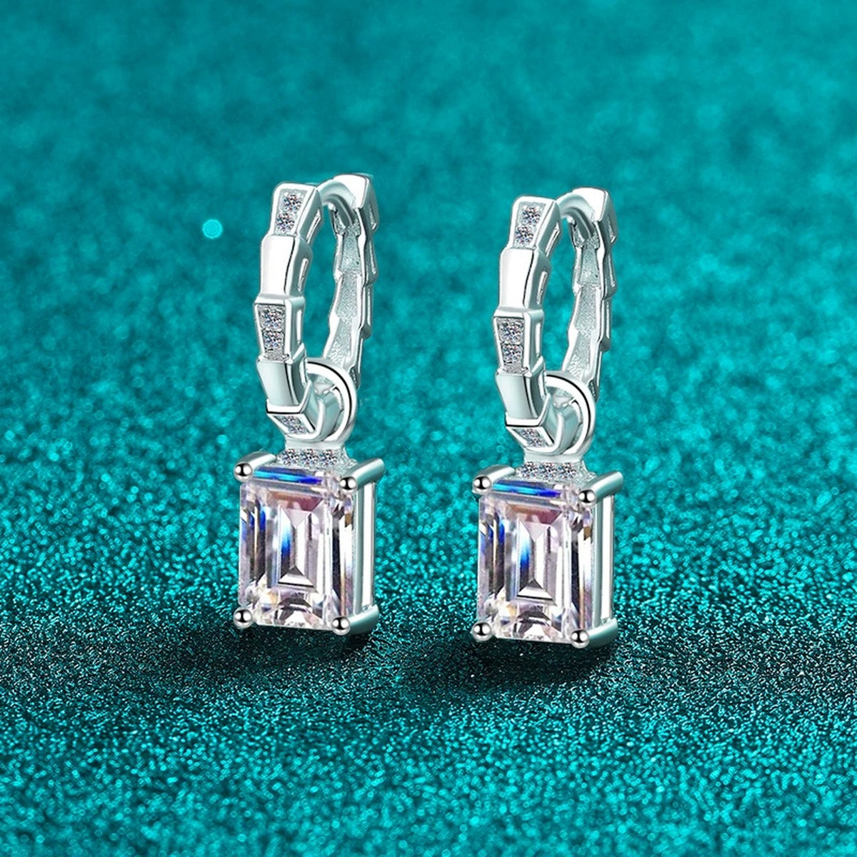 Emerald and Radiant Cut Moissanite Hoop Dangle Earrings in Rhodium-Plated S925 sterling silver product scene view showing angled setting detail