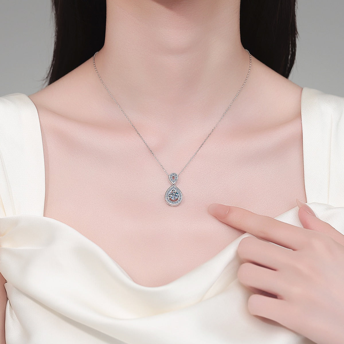 Teardrop Halo Moissanite Pendant Necklace with CZ in Rhodium-Plated S925 sterling silver neckline model view showing pendant scale and adjustable chain